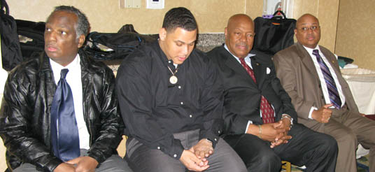 four men seated