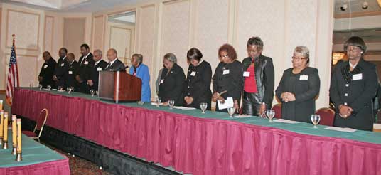 men and women at head table