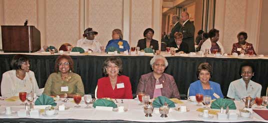women at head table