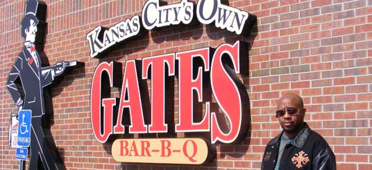 man in front of gates