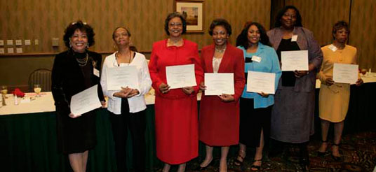 ladies hold certificates
