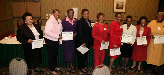 ladies hold certificates